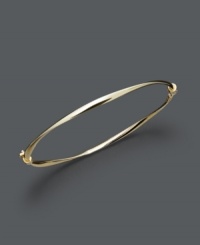 Add a luxurious layer for simple refinement. Bangle features a subtle twist design crafted in 14k gold. Approximate diameter: 2-3/8 inches.