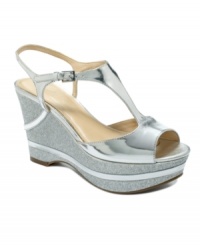 Enjoy your night out with comfort and style. Marc Fisher's Great Platform wedge evening sandals feature a glitter upper and a darling t-strap on the vamp. Enjoy your night out with comfort and style. Marc Fisher's Great Platform wedge evening sandals feature a glitter upper and a darling t-strap on the vamp.