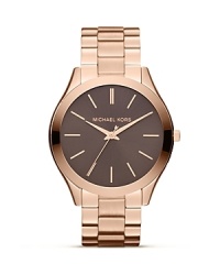 Michael Kors' Runway timepiece is a piece of high fashion hardware. Cast in rose gold with a classic, three-link bracelet, it flaunts an outfit-finishing elegance. Michael Kors' Runway timepiece is a piece of high fashion hardware. Cast in rose gold with a classic, three-link bracelet, it flaunts an outfit-finishing elegance.
