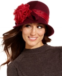 Flower power. Reveal your romantic side with this contemporary cloche from August, featuring a sheer contrasting ribbon with a flirty floral accent. Ideal for almost any occasion. Flower power. Reveal your romantic side with this contemporary cloche from August, featuring a sheer contrasting ribbon with a flirty floral accent. Ideal for almost any occasion.