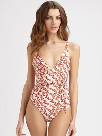 Ever-flattering, a wrap top with convenient self ties and the right amount of stretch offer a virtually customized fit. V-necklineSelf-tie, wrap topSnap frontFront pocketsRibbed trimFully lined80% polyamide/20% elastaneHand washImported of Italian fabric Ever-flattering, a wrap top with convenient self ties and the right amount of stretch offer a virtually customized fit. V-necklineSelf-tie, wrap topSnap frontFront pocketsRibbed trimFully lined80% polyamide/20% elastaneHand washImported of Italian fabric
