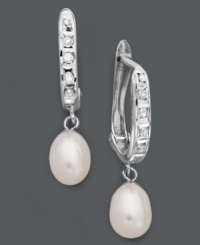 Totally refined. For a completely sophisticated look, just add these shimmering hoop earrings. Crafted in sterling silver, earrings feature cultured freshwater pearl drops (6 mm) and round-cut diamond accents. Approximate drop: 1 inch. Totally refined. For a completely sophisticated look, just add these shimmering hoop earrings. Crafted in sterling silver, earrings feature cultured freshwater pearl drops (6 mm) and round-cut diamond accents. Approximate drop: 1 inch.