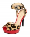 A perfect pick for summer. The Tulip platform sandals by Marc Fisher feature a sexy leopard print that's accented with a pop of bright red on the platform.