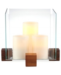 Sheer brilliance. Three candles contained within a block of glass and raised on blocks of wood add modern intrigue to your patio or picnic table. From Dansk. Sheer brilliance. Three candles contained within a block of glass and raised on blocks of wood add modern intrigue to your patio or picnic table. From Dansk.