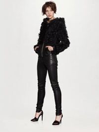 A luxurious layer in soft shearling with a striking goldtone zipper.Attached hoodLong sleeves with cuffsZip front closureSplit kangaroo pocketAbout 27 from shoulder to hemLambskinDry clean with leather professionalModel shown is 5'10 (177cm) wearing US size Small. A luxurious layer in soft shearling with a striking goldtone zipper.Attached hoodLong sleeves with cuffsZip front closureSplit kangaroo pocketAbout 27 from shoulder to hemLambskinDry clean with leather professionalModel shown is 5'10 (177cm) wearing US size Small.