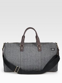 Inspired by suiting fabrics, this wool herringbone is a classic men's fabrication crafted for the stylish traveler.Zip closureDouble top handlesAdjustable shoulder strapWool/leather20W x 11H x 9DImported Inspired by suiting fabrics, this wool herringbone is a classic men's fabrication crafted for the stylish traveler.Zip closureDouble top handlesAdjustable shoulder strapWool/leather20W x 11H x 9DImported