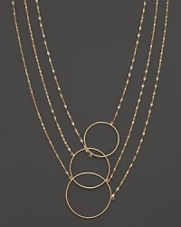 Interlocking circles and gleaming chains of 14K yellow gold. By Lana. Interlocking circles and gleaming chains of 14K yellow gold. By Lana.