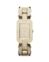 Gorgeous clear stones define the sleek bracelet of a glamorous Michael Kors three-hand watch, finished in glossy gold plated metal. Gorgeous clear stones define the sleek bracelet of a glamorous Michael Kors three-hand watch, finished in glossy gold plated metal.