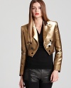 This gold lamé Jean Paul Gauliter jacket delivers decadence at every turn-glimmering in majestic style with unmissable inspiration from the 1970s. Standout and stellar, layer the luxe look over a black tee with leather skinnies and shine on.