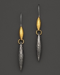 Hammered dark silver drop earring cast in an oblong teardrop with 24 Kt. yellow gold accents. Hammered dark silver drop earring cast in an oblong teardrop with 24 Kt. yellow gold accents.