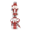 The Platinum Grande Nutcrackers shimmer and shine atop an assortment of red, white and black boxes.