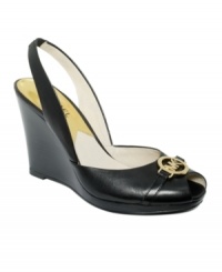 The Rochelle slingback pumps by MICHAEL by Michael Kors feature a moderate stacked wedge heel with a cute, golden designer charm at the toe. The Rochelle slingback pumps by MICHAEL by Michael Kors feature a moderate stacked wedge heel with a cute, golden designer charm at the toe.