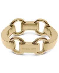 Slip on this linked style for the perfect finishing touch. This Michael Kors bracelet features chunky details with engraved logos. Crafted in gold tone brass. Approximate length: 8 inches. Approximate width: 1 inch. Slip on this linked style for the perfect finishing touch. This Michael Kors bracelet features chunky details with engraved logos. Crafted in gold tone brass. Approximate length: 8 inches. Approximate width: 1 inch.