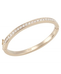 Go for the gold with this sparkling bangle by Carolee. Bracelet crafted in gold tone mixed metal with set glass stones and hinge closure. Approximate diameter: 2-1/4 inches x 1-7/8 inches. Go for the gold with this sparkling bangle by Carolee. Bracelet crafted in gold tone mixed metal with set glass stones and hinge closure. Approximate diameter: 2-1/4 inches x 1-7/8 inches.