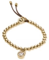 Michael Kors' beautifully-beaded padlock bracelet is crafted in gold tone steel with an adjustable brown leather clasp. Features a glass accent at the padlock charm and a logo charm at the closure. Bracelet also stretches to fit wrist. Approximate diameter: 2-1/4 inches. Michael Kors' beautifully-beaded padlock bracelet is crafted in gold tone steel with an adjustable brown leather clasp. Features a glass accent at the padlock charm and a logo charm at the closure. Bracelet also stretches to fit wrist. Approximate diameter: 2-1/4 inches.