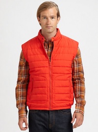 A sharp, sleeveless layering staple, crafted in quilted nylon with zippered pockets for style and comfort.Zip frontStand collarZippered waist pocketsAbout 25 from shoulder to hemNylonDry cleanImported A sharp, sleeveless layering staple, crafted in quilted nylon with zippered pockets for style and comfort.Zip frontStand collarZippered waist pocketsAbout 25 from shoulder to hemNylonDry cleanImported