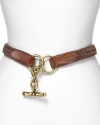 Define your waistline with this woven leather belt from Lauren Ralph Lauren. Boasting a brass toggle closure, it lends a classic, all-American finish.