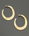 A subtly asymmetrical shape gives these goldtone mixed metal hoop earrings from Kenneth Cole New York a rustic undertone. Each measures approximately 1-3/4 inches.