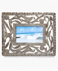 Change the landscape with the eco-friendly Open Leaf picture frame by Mirtha Balan. Recycled steel hand-cut and hammered with precise and beautiful detail surrounds images of your favorite people and places like a lush Haitian canopy. Change the landscape with the eco-friendly Open Leaf picture frame by Mirtha Balan. Recycled steel hand-cut and hammered with precise and beautiful detail surrounds images of your favorite people and places like a lush Haitian canopy.
