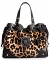 For the love of leopard, this plush velour design from Juicy Couture adds instant allure to any ensemble. Featuring luxe leather handles, golden stud accents and flirty drawstring bows, it's easy to see why this look is so purr-fect.