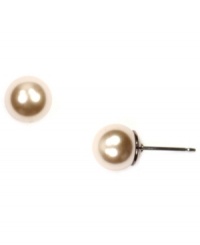Simple sophistication by Givenchy. Stud earrings feature polished glass pearls in brown gold-plated mixed metal. Approximate diameter: 3/4 inch. Simple sophistication by Givenchy. Stud earrings feature polished glass pearls in brown gold-plated mixed metal. Approximate diameter: 3/4 inch.
