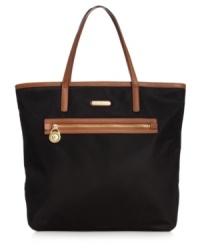 Practical and poised for work or play, this roomy tote from MICHAEL Michael Kors is an everyday essential. Made from durable nylon with sturdy straps and plenty of pockets, it's ideally sized for shopping trips or jaunts to the gym. Practical and poised for work or play, this roomy tote from MICHAEL Michael Kors is an everyday essential. Made from durable nylon with sturdy straps and plenty of pockets, it's ideally sized for shopping trips or jaunts to the gym.