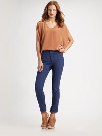 Shimmering silk v-neck in an oversized silhouette with open three-quarter sleeves. V-neckOpen three-quarter sleevesLonger length hits below the hipsSilkDry cleanImported Shimmering silk v-neck in an oversized silhouette with open three-quarter sleeves. V-neckOpen three-quarter sleevesLonger length hits below the hipsSilkDry cleanImported