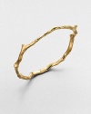 From the Glamazon Collection. A craggy, angled branch motif, borrowed from a coral reef, stunningly executed in an 18k gold bangle.18k yellow goldDiameter, about 2.6Imported