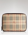 A luxe laptop sleeve in Burberry's signature check with leather trims.
