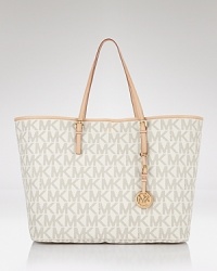 When the itinerary calls for something roomy and sophisticated, MICHAEL Michael Kors' logo-splashed tote is a first class upgrade. Carry it whether you're headed to work or somewhere more exotic. When the itinerary calls for something roomy and sophisticated, MICHAEL Michael Kors' logo-splashed tote is a first class upgrade. Carry it whether you're headed to work or somewhere more exotic.