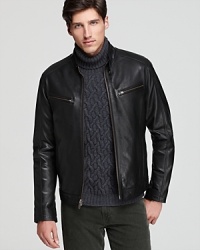 In a heavy leather that keeps in warmth, this Cole Haan moto jacket mixes edge with practicality. In a heavy leather that keeps in warmth, this Cole Haan moto jacket mixes edge with practicality.