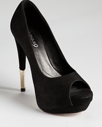 A gleaming gold-tone heel tip lends a gilded finish to Boutique 9's Nalanee pumps, a towering, peep toe silhouette in suede black as night. A gleaming gold-tone heel tip lends a gilded finish to Boutique 9's Nalanee pumps, a towering, peep toe silhouette in suede black as night.