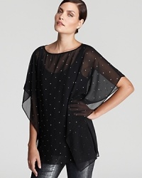 Gilded studs toughen up a sheer MICHAEL Michael Kors top for a pretty-in-punk look. Team with leather leggings and revel in rocker luxe. Gilded studs toughen up a sheer MICHAEL Michael Kors top for a pretty-in-punk look. Team with leather leggings and revel in rocker luxe.