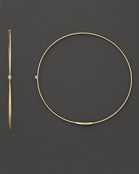 Single diamonds wink from the center of these delicate 14K gold hoops. Single diamonds wink from the center of these delicate 14K gold hoops.