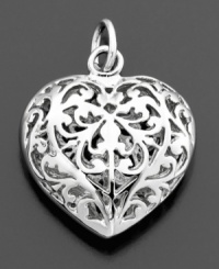 Romantic and lovely, this filigree heart charm is crafted in sterling silver. By Rembrandt Charms. Approximate drop: 3/4 inches. Romantic and lovely, this filigree heart charm is crafted in sterling silver. By Rembrandt Charms. Approximate drop: 3/4 inches.