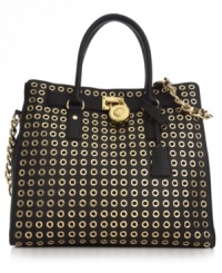 Destined to delight, this classic carryall from MICHAEL Michael Kors is dressed in golden grommets and signature detailing. Ultra-spacious with plenty of pockets, it's designed to meet all your daily demands. Destined to delight, this classic carryall from MICHAEL Michael Kors is dressed in golden grommets and signature detailing. Ultra-spacious with plenty of pockets, it's designed to meet all your daily demands.
