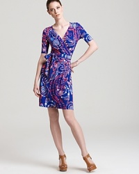 A kaleidoscope of print infuses a classic Lilly Pulitzer wrap dress with modern femininity. Punctuate the vibrant silhouette with acid-bright accents and live colorfully. A kaleidoscope of print infuses a classic Lilly Pulitzer wrap dress with modern femininity. Punctuate the vibrant silhouette with acid-bright accents and live colorfully.