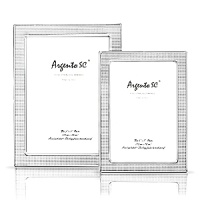 Argento Nail Head sterling silver frames. Dual easel for portrait and landscape tabletop display. Solid .925 fine sterling silver. Clear lacquered for tarnish free appearance. Argento Nail Head sterling silver frames. Dual easel for portrait and landscape tabletop display. Solid .925 fine sterling silver. Clear lacquered for tarnish free appearance.