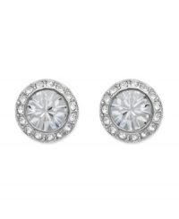 Add spark to your style with subtle fashion. Swarovski's chic, circular studs feature a round-cut crystal center stone surrounded by sparkling crystal edges. Crafted in silver tone mixed metal. Approximate diameter: 1/3 inch. Add spark to your style with subtle fashion. Swarovski's chic, circular studs feature a round-cut crystal center stone surrounded by sparkling crystal edges. Crafted in silver tone mixed metal. Approximate diameter: 1/3 inch.