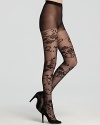 Swirling floral tulle draws attention to your lovely legs. Control top hosiery by DKNY.
