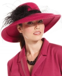 Dressed to impress. This stunning hat by August is perfect for that special occasion. The romantic broad brim design is presented with a flirty feather and elegant veil accent; it's destined to turn more than a few heads.