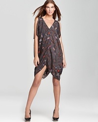 Mara Hoffman continues her reign of utterly unique prints and patterns with this draped poncho dress, edgy in a galactic-meets-geometric print.