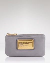 Key in and covet this MARC BY MARC JACOBS pouch, coolly crafted of leather with simply styled detailing. Key in and covet this MARC BY MARC JACOBS pouch, coolly crafted of leather with simply styled detailing.