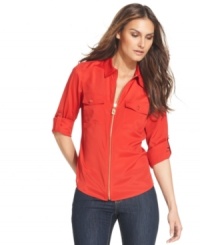 A classic piece gets a decidedly fresh look, from MICHAEL Michael Kors. This shirt features military-inspired details like a metal pull and zip-up front for an appealing edge! A classic piece gets a decidedly fresh look, from MICHAEL Michael Kors. This shirt features military-inspired details like a metal pull and zip-up front for an appealing edge!