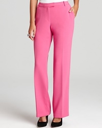 Bold color and classic tailoring combine for an impeccably chic pair of Calvin Klein pants. Accentuate the sharp silhouette with lofty heels and rise to new fashion heights.