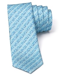 Indulge in the exceptionally soft, textured silk of this fine tie from HUGO, featuring a skinny silhouette for modern appeal and an alluring stripe pattern. Indulge in the exceptionally soft, textured silk of this fine tie from HUGO, featuring a skinny silhouette for modern appeal and an alluring stripe pattern.