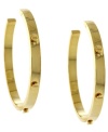Although called the basic earrings, these hoops are anything but. Vince Camuto's edgy style features a rustic look with screw head studs outlining the circumference. Crafted in gold tone mixed metal. Approximate diameter: 1-3/4 inches.