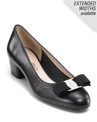 Sophisticated leather pumps with a classic Ferragamo bow and logo plate at toe. Sophisticated leather pumps with a classic Ferragamo bow and logo plate at toe.