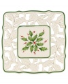 With bands of green, pierced detail and a holly motif to match the beloved Holiday dinnerware pattern, this porcelain trivet from Lenox protects a festive table.