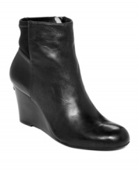 MICHAEL Michael Kors' Bromley wedge booties are perfectly polished with a smooth round toe and a zipper closure on the inner bootie. MICHAEL Michael Kors' Bromley wedge booties are perfectly polished with a smooth round toe and a zipper closure on the inner bootie.